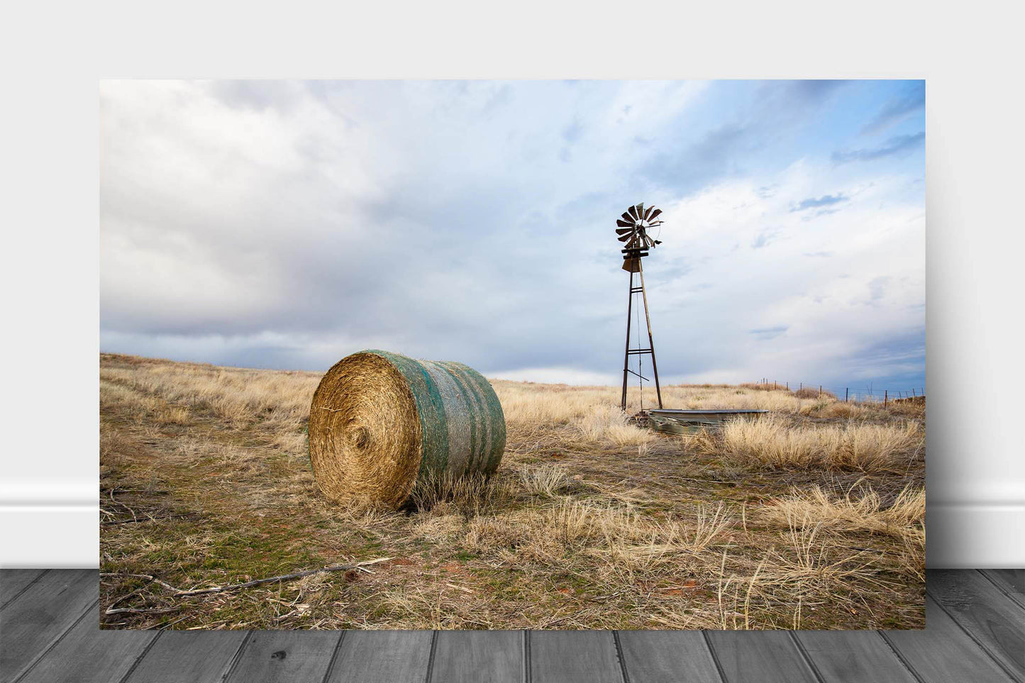 Country aluminum metal print wall art of an old windmill and round hay bale on an autumn day on the Oklahoma prairie by Sean Ramsey of Southern Plains Photography.