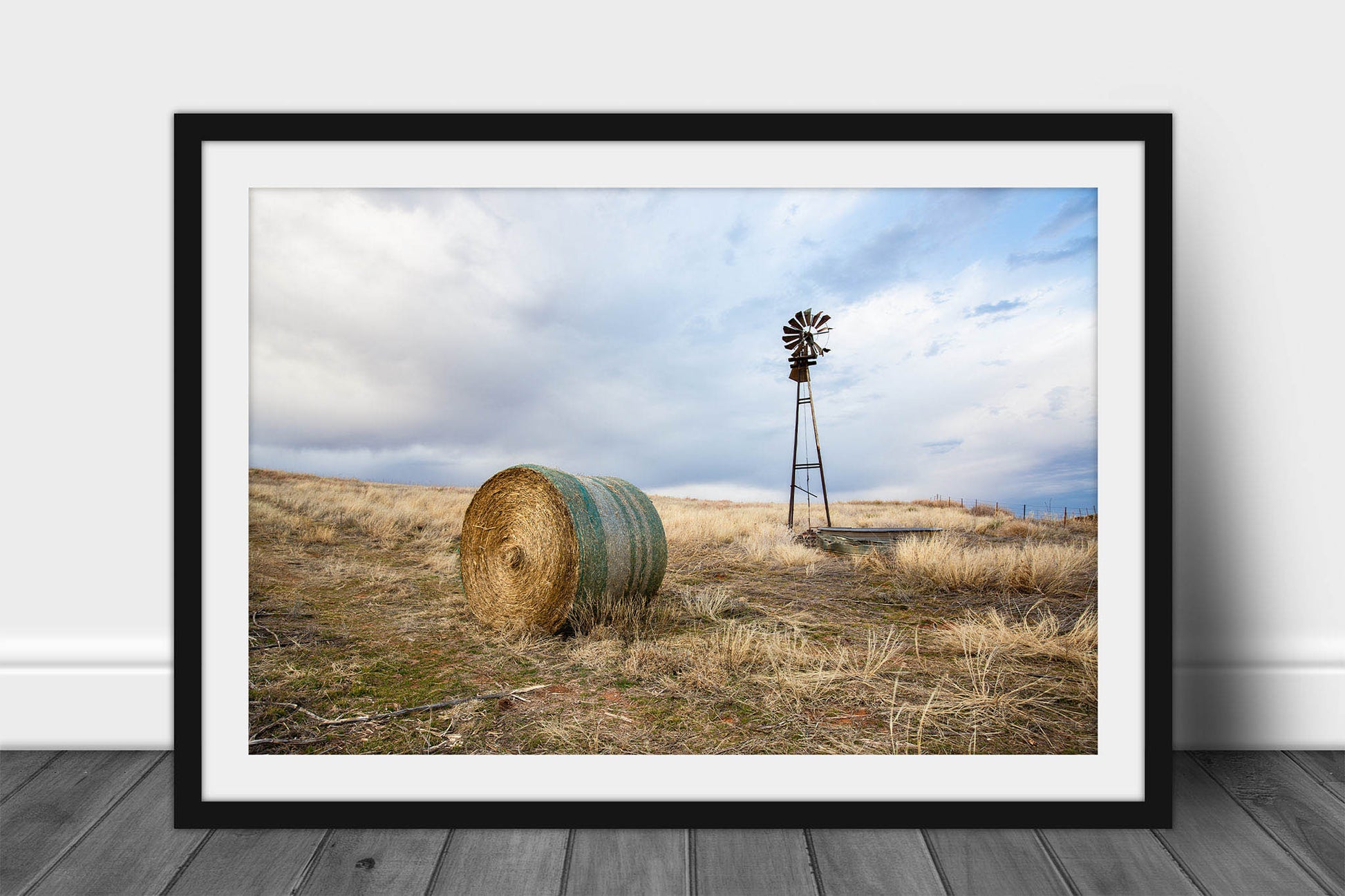 Framed and matted country print of an old windmill and round hay bale on an autumn day on the Oklahoma prairie by Sean Ramsey of Southern Plains Photography.
