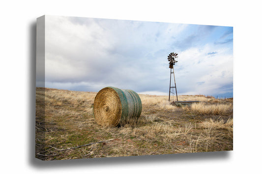 Country canvas wall art of an old windmill and round hay bale on an autumn day on the Oklahoma prairie by Sean Ramsey of Southern Plains Photography.