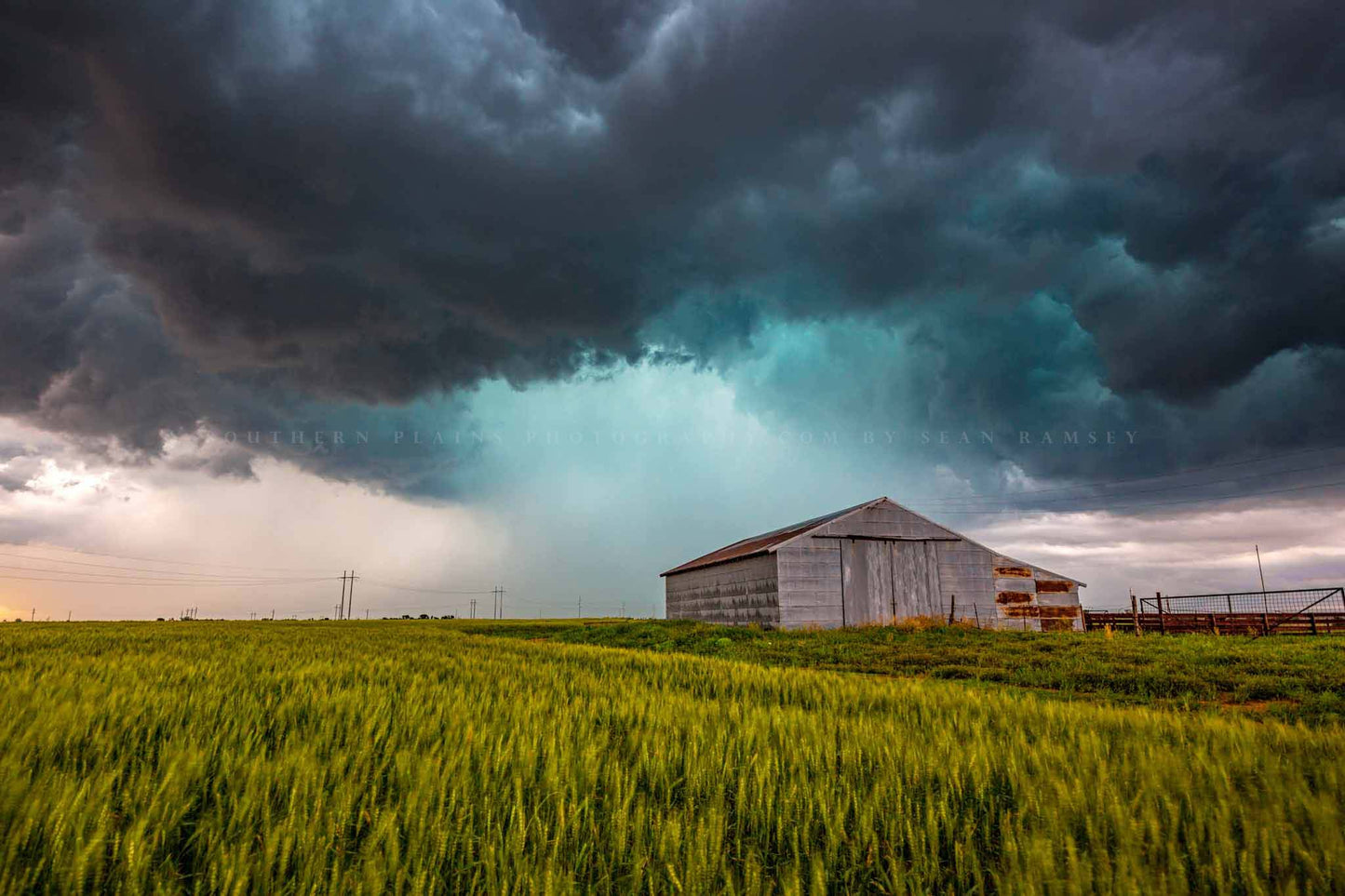 Storm photography print of an intense thunderstorm passing behind an old tin covered barn on a stormy spring day in Oklahoma by Sean Ramsey of Southern Plains Photography.