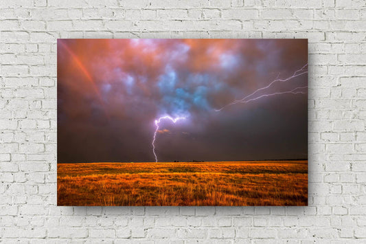 Storm metal print of lightning striking over a field as a rainbow shines within a stormy sky at sunset on a spring evening in Oklahoma by Sean Ramsey of Southern Plains Photography.