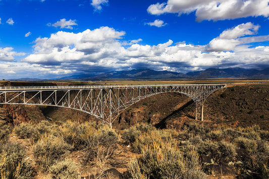 Travel photography print of the Rio Grande Gorge Bridge under a big blue sky on an autumn day near Taos, New Mexico by Sean Ramsey of Southern Plains Photography.