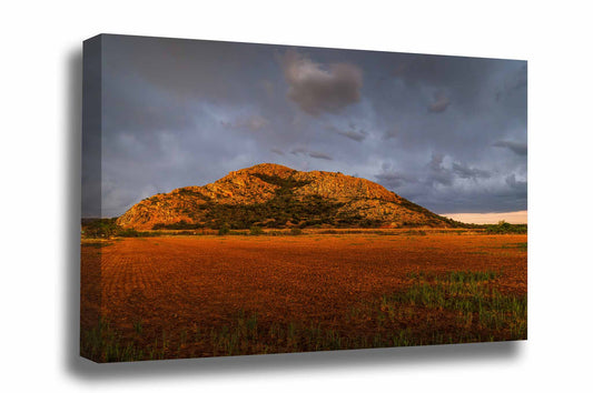 Landscape gallery wrapped canvas wall art of the Quartz Mountains rising abruptly over a field as a thunderstorm passes overhead in southwest Oklahoma by Sean Ramsey of Southern Plains Photography.