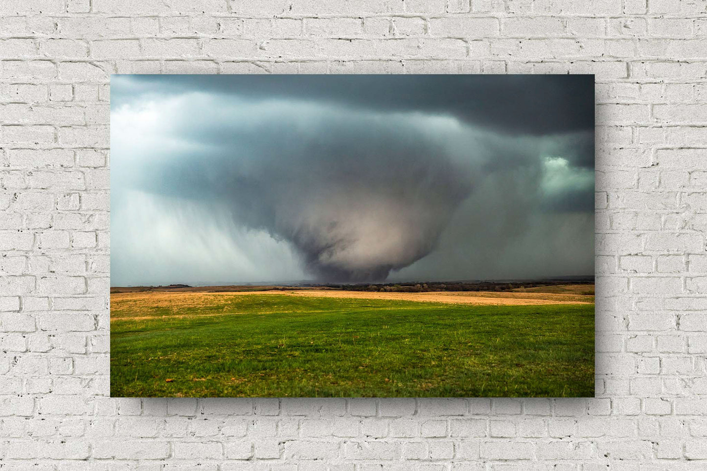 Storm metal print wall art of a large tornado rumbling over open prairie on a stormy spring day in Kansas by Sean Ramsey of Southern Plains Photography.