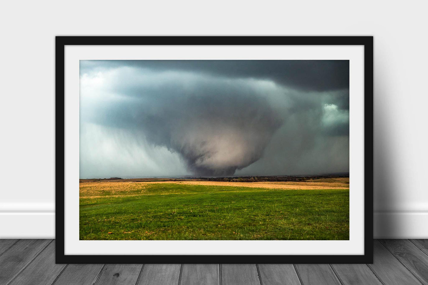 Framed storm print of a large tornado rumbling over open plains on a stormy spring day in Kansas by Sean Ramsey of Southern Plains Photography.
