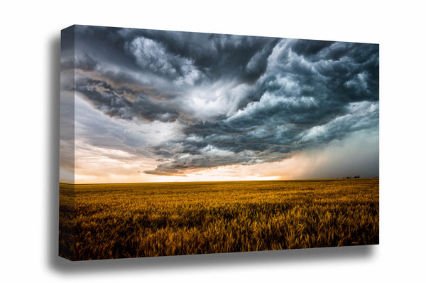 Western canvas wall art of storm clouds churning over an amber wheat field on a stormy spring day on the plains of Colorado by Sean Ramsey of Southern Plains Photography.