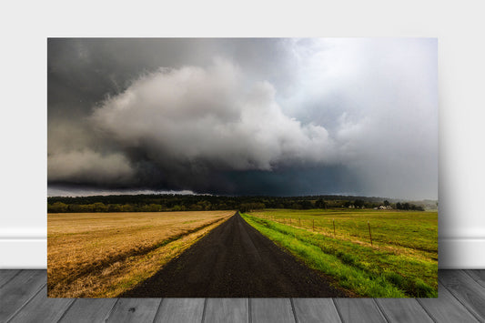 Thunderstorm aluminum metal print wall art of a road leading to ominous storm clouds over hills in the Ouachita Mountains in Arkansas by Sean Ramsey of Southern Plains Photography.