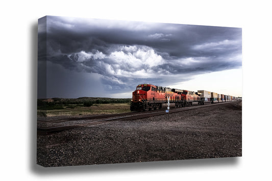 Train gallery wrapped canvas wall art of a locomotive rolling through a rural intersection and storm clouds churn above on a stormy spring day in Texas by Sean Ramsey of Southern Plains Photography.