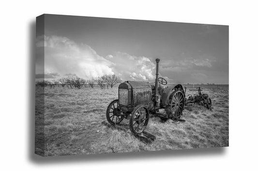 Farmhouse canvas wall art of a rustic McCormick-Deering tractor on a stormy spring day in Texas in black and white by Sean Ramsey of Southern Plains Photography.
