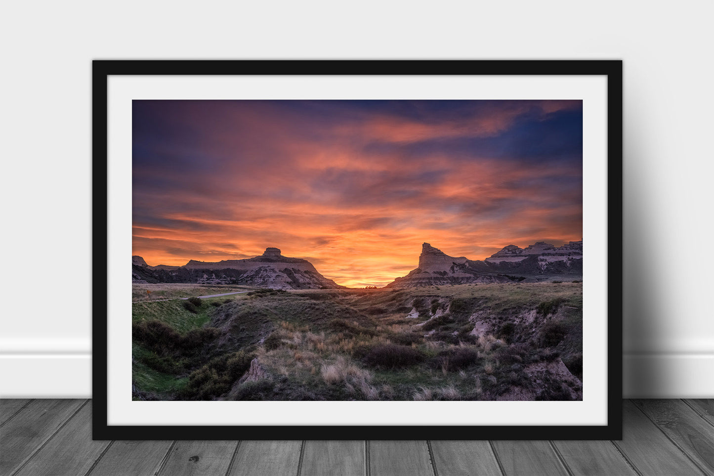 Framed prairie print of a vivid sunset taking place over Scotts Bluff National Monument near Scottsbluff, Nebraska by Sean Ramsey of Southern Plains Photography.