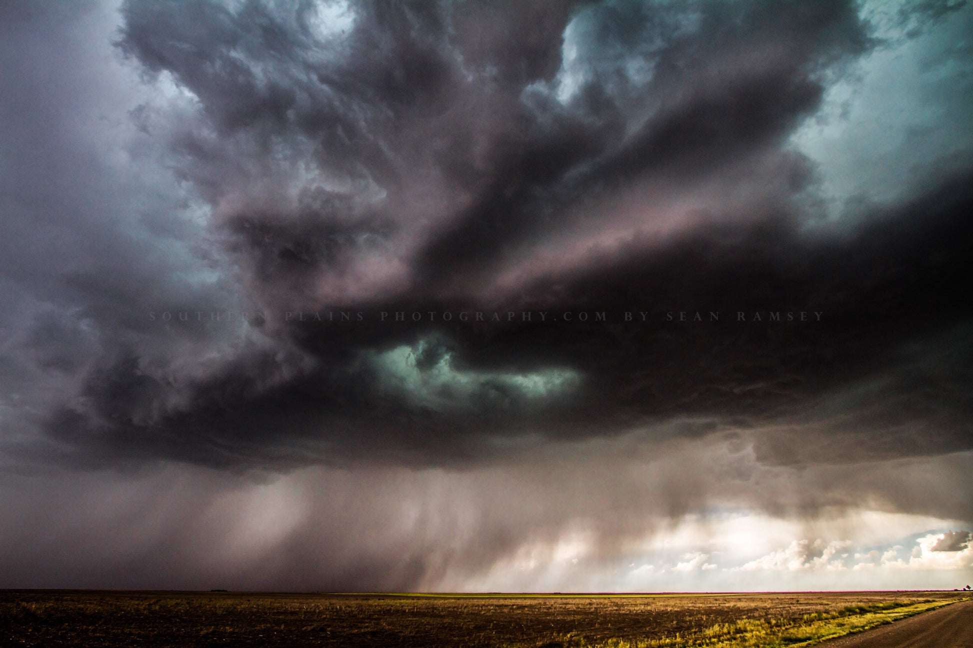 Thunderstorm photography print of dark and ominous storm clouds filling the sky and brining rain to the plains of Kansas by Sean Ramsey of Southern Plains Photography.