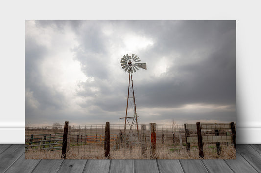 Midwest metal print wall art on aluminum of an old windmill standing against a stormy sky on a spring day in Iowa by Sean Ramsey of Southern Plains Photography.