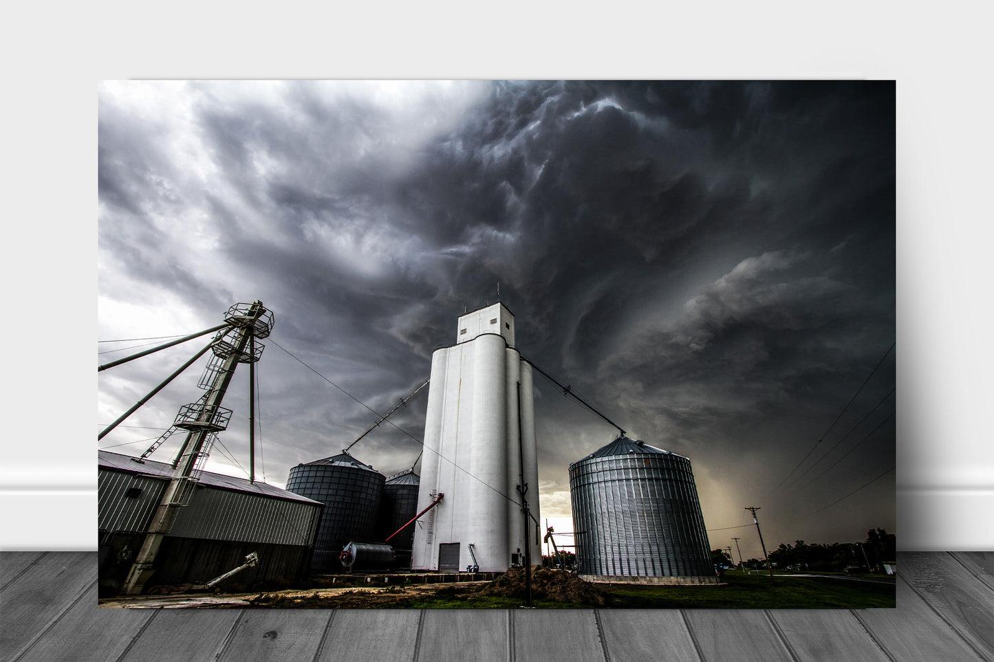 Thunderstorm metal print on aluminum of storm clouds swirling over a grain elevator in a small town in Kansas by Sean Ramsey of Southern Plains Photography.
