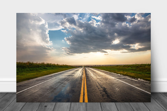 Road aluminum metal print wall art of a rain soaked highway going on forever as golden sunlight begins to fill the sky after a stormy day in Oklahoma by Sean Ramsey of Southern Plains Photography.