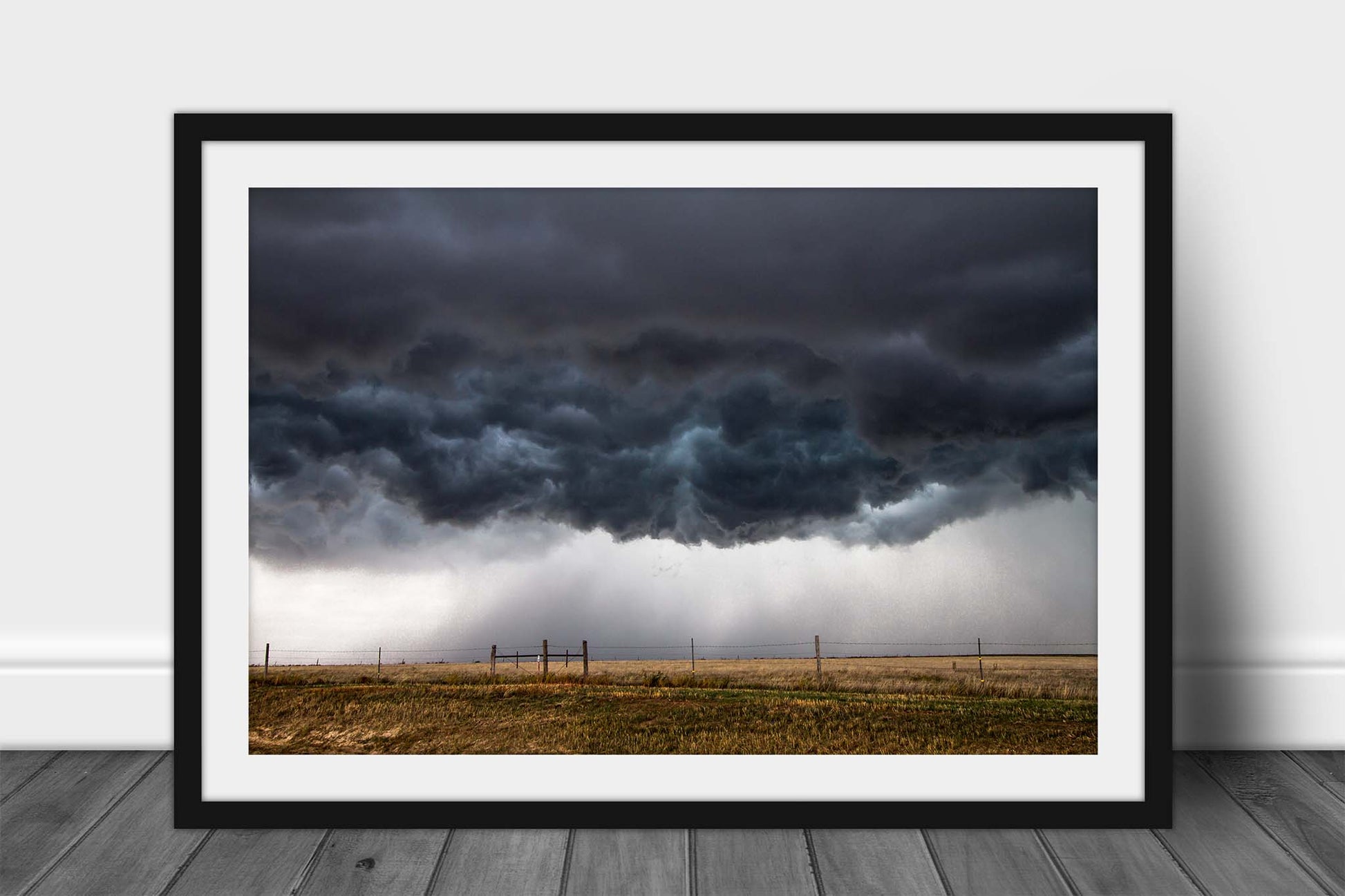 Framed thunderstorm print wall art of low hanging storm clouds boiling over plains n a stormy day in Kansas by Sean Ramsey of Southern Plains Photography.
