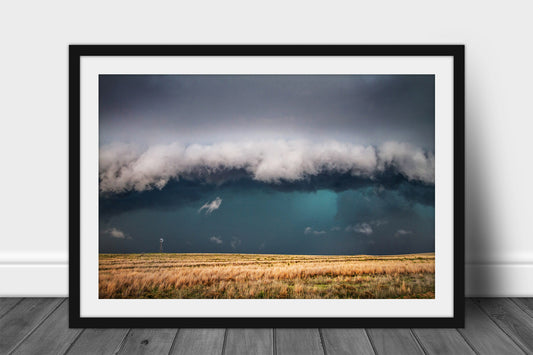 Framed and matted thunderstorm print of a storm engulfing a windmill on a stormy day on the open plains of Texas by Sean Ramsey of Southern Plains Photography.