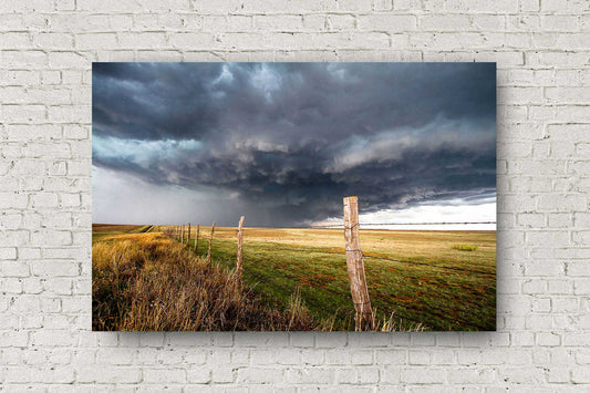 Storm photography print of an intense thunderstorm with a gentle appearance over a barbed wire fence on a stormy spring day on the plains of the Texas panhandle by Sean Ramsey of Southern Plains Photography.