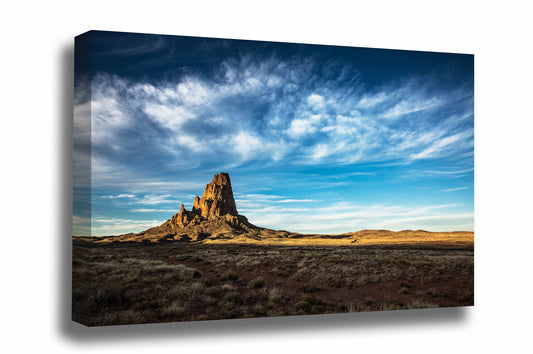 Western landscape gallery wrapped canvas wall art of Agathla Peak drenched in evening sunlight under big blue sky full of wispy cirrus clouds by Sean Ramsey of Southern Plains Photography.