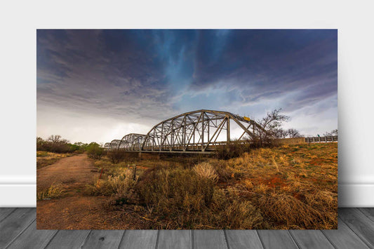 Storm aluminum metal print wall art of an aqua colored thunderstorm over and old bridge in the Texas Panhandle by Sean Ramsey of Southern Plains Photography.