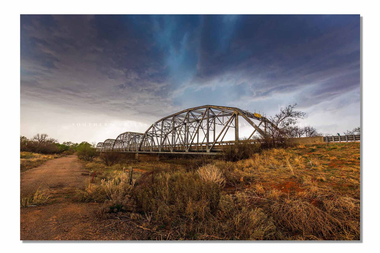 Storm photography print of an aqua colored thunderstorm over and old bridge in the Texas Panhandle by Sean Ramsey of Southern Plains Photography.