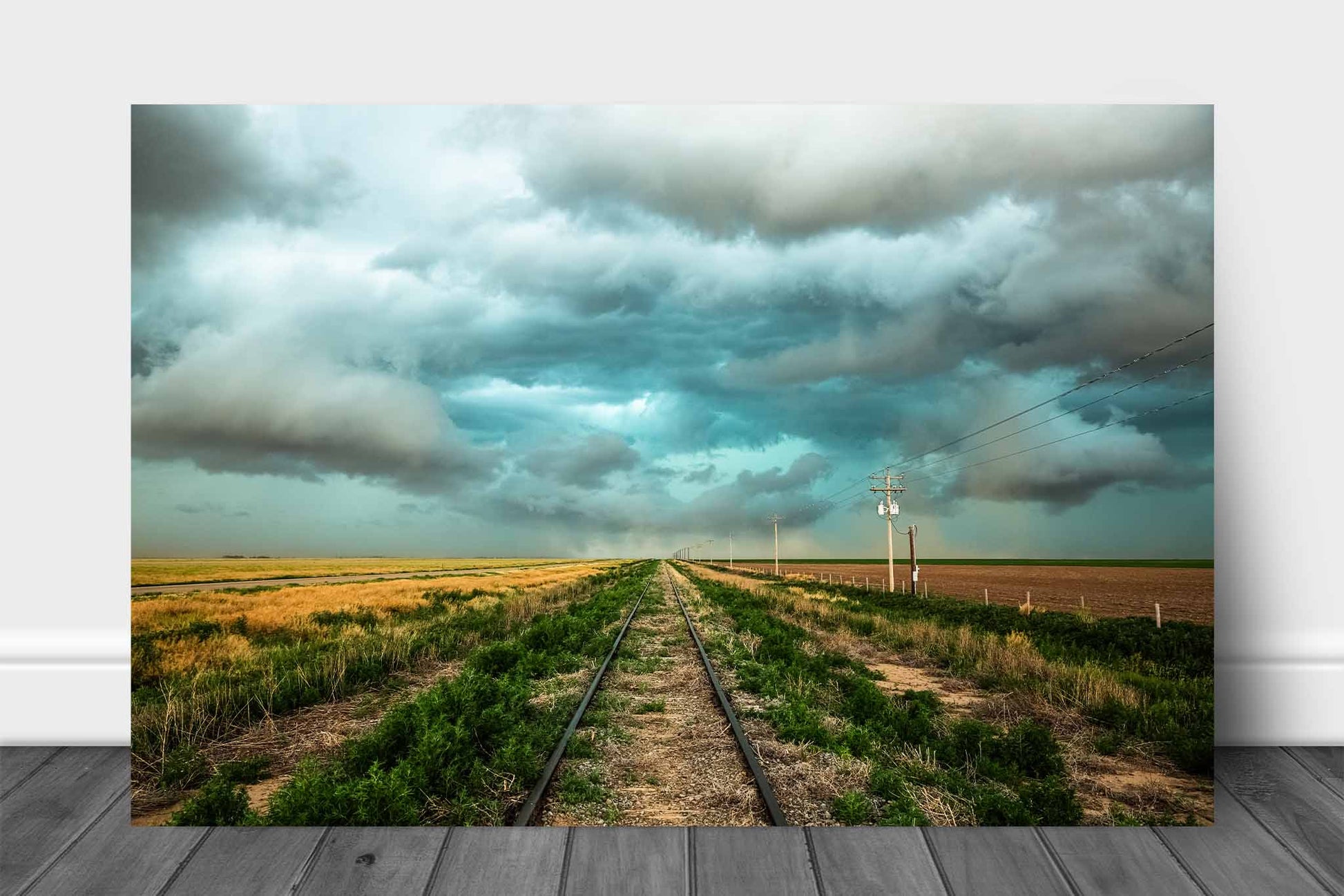 Railroad aluminum metal print wall art of train tracks leading to a stormy sky on the plains of Colorado by Sean Ramsey of Southern Plains Photography.