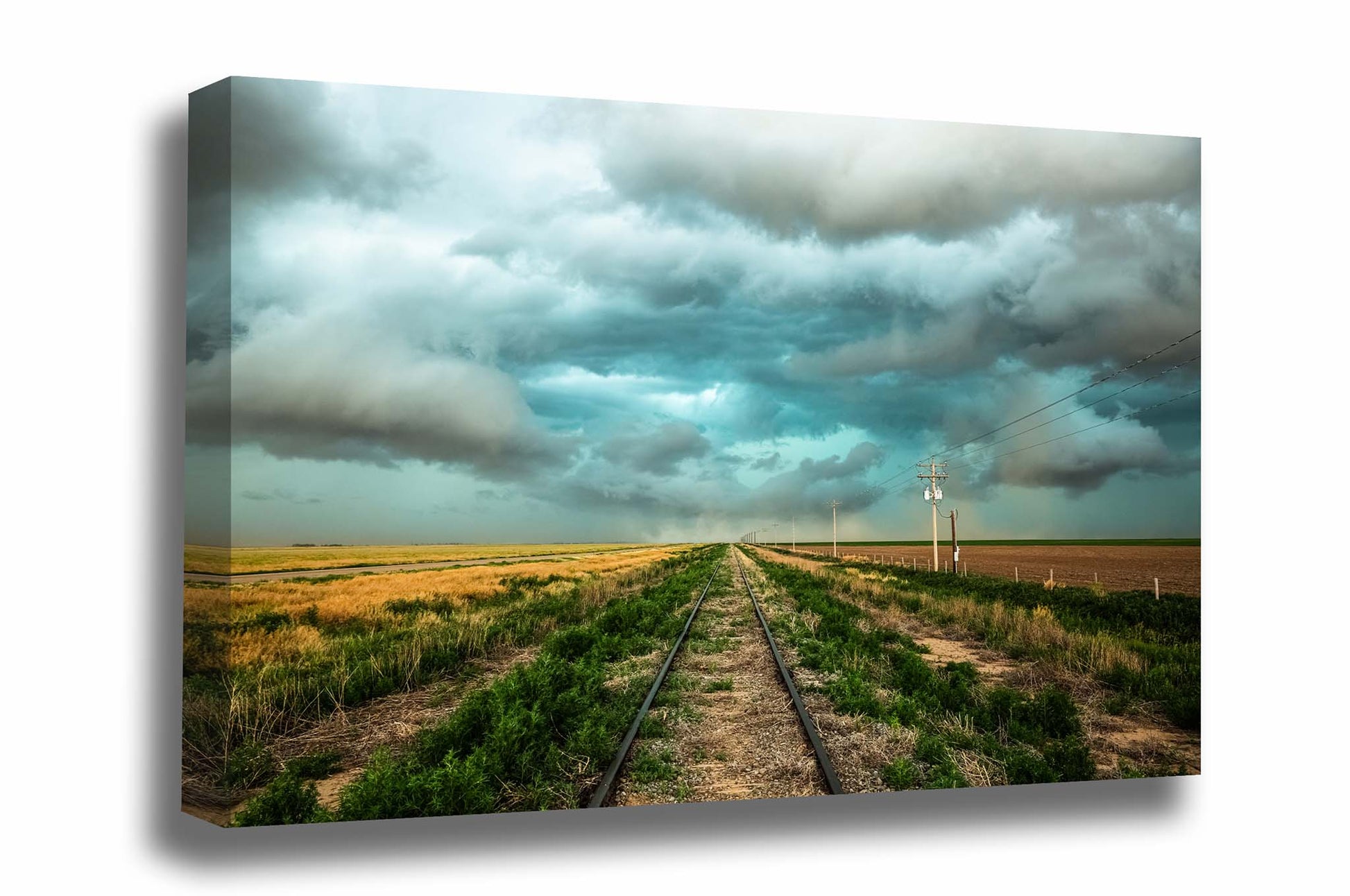Railroad gallery wrapped canvas wall art of train tracks leading to a stormy sky on the plains of Colorado by Sean Ramsey of Southern Plains Photography.