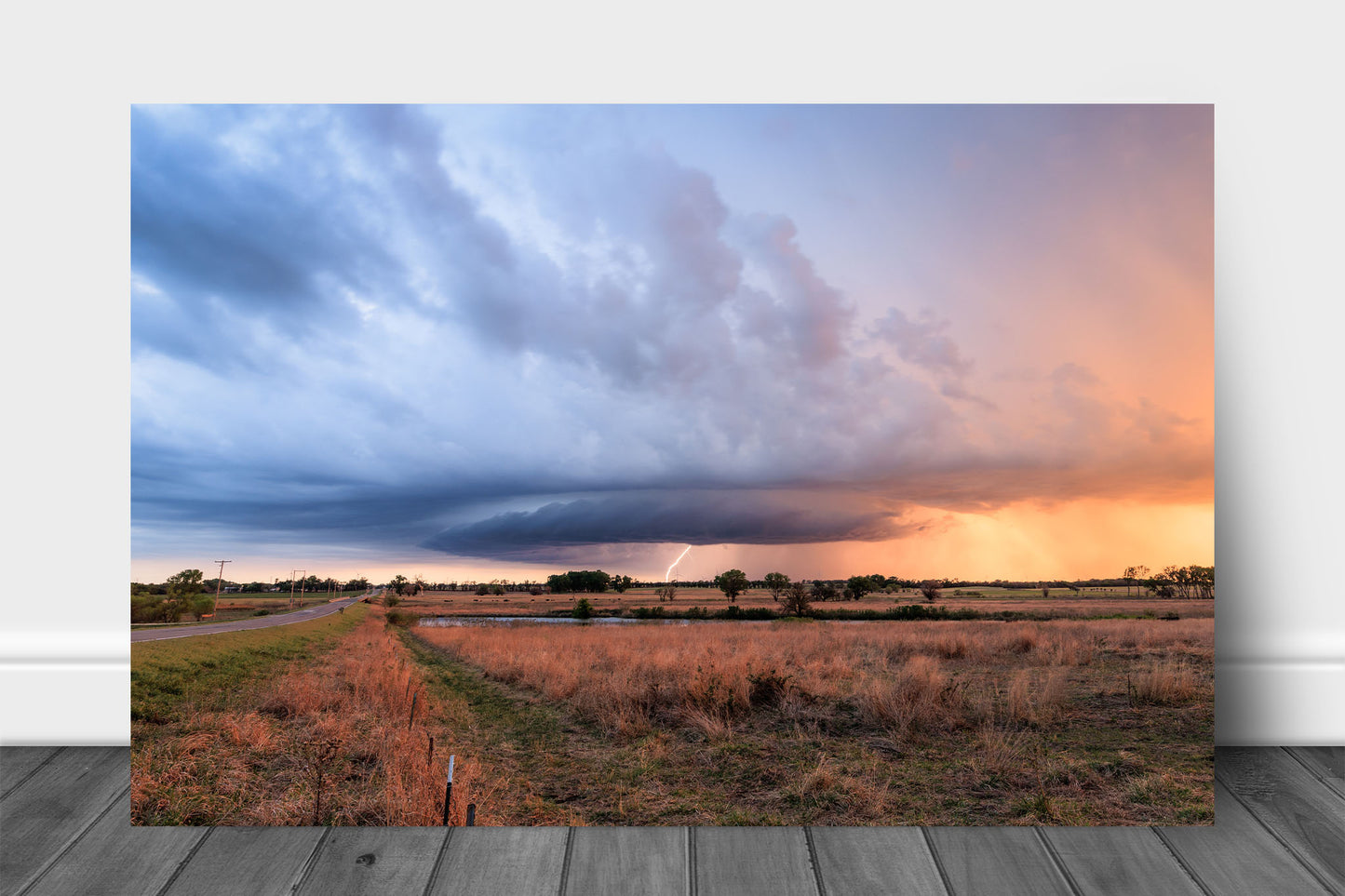 Storm metal print wall art of a supercell thunderstorm with a lightning bolt at sunset on a stormy evening on the Kansas prairie by Sean Ramsey of Southern Plains Photography.