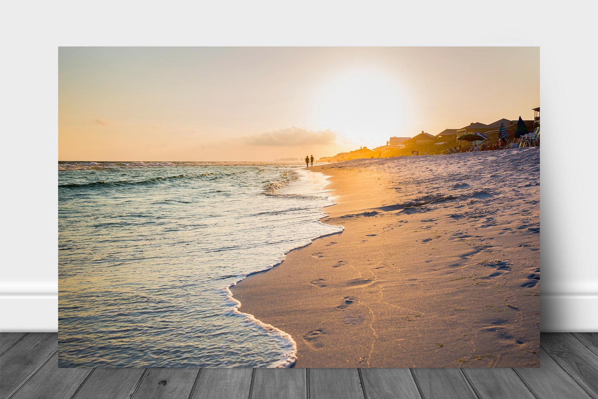 Coastal aluminum metal print wall art of waves washing away footprints as people walk along beach at sunset along the Gulf Coast near Destin, Florida by Sean Ramsey of Southern Plains Photography.