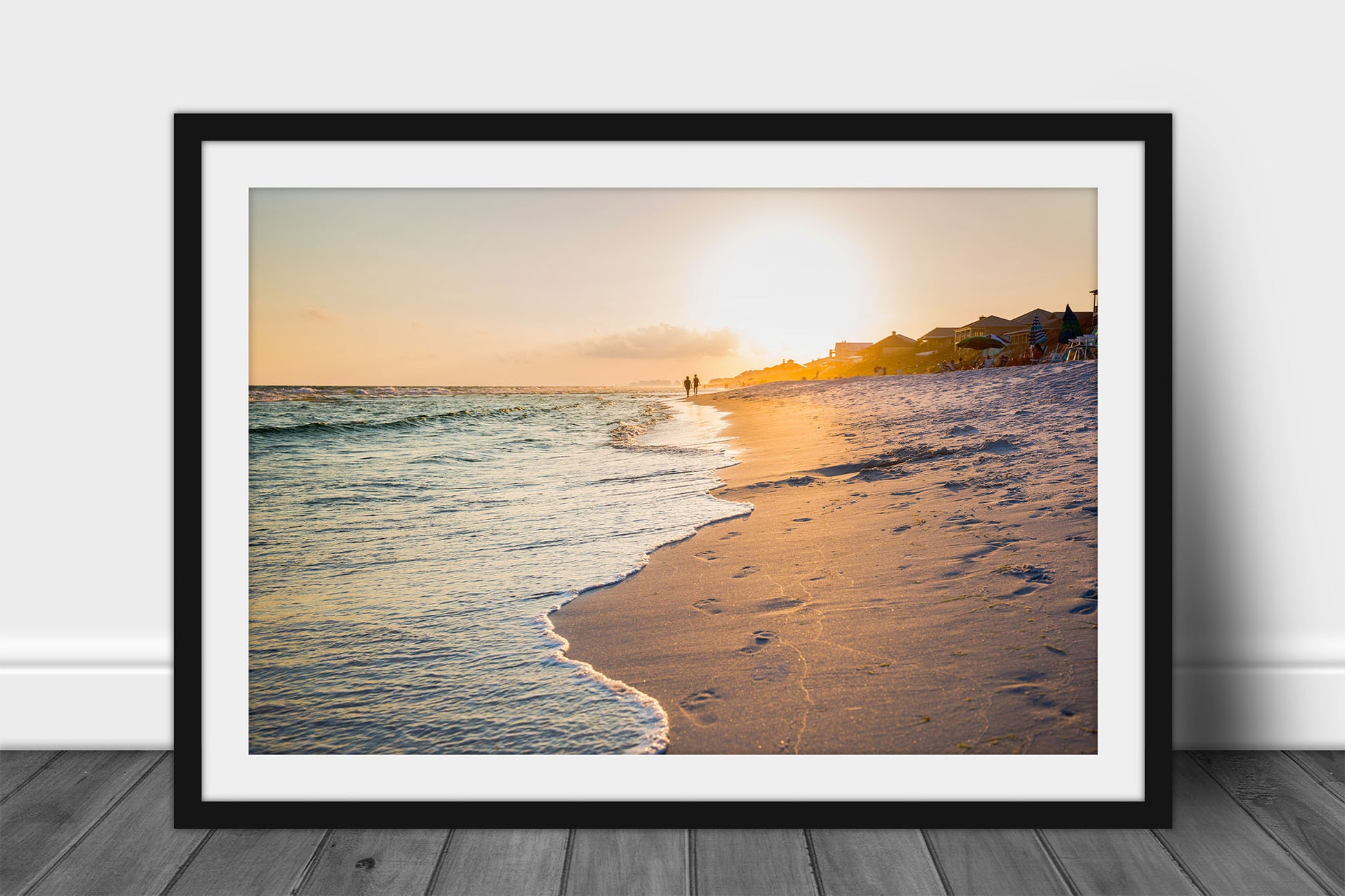 Framed and matted coastal print of waves washing away footprints as people walk along beach at sunset along the Gulf Coast near Destin, Florida by Sean Ramsey of Southern Plains Photography.