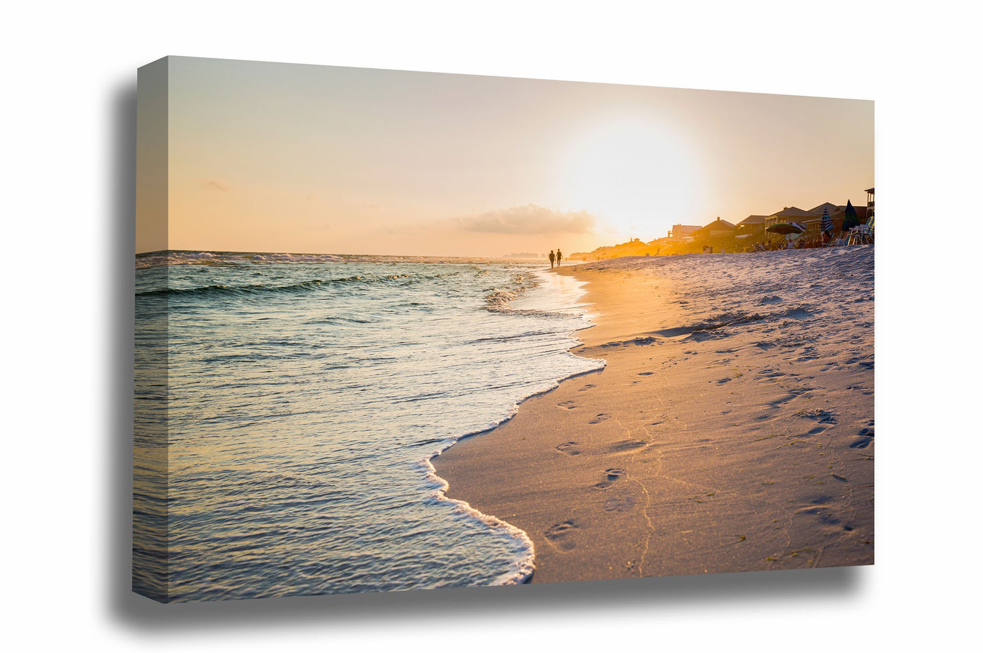 Coastal canvas wall art of waves washing away footprints as people walk along beach at sunset along the Gulf Coast near Destin, Florida by Sean Ramsey of Southern Plains Photography.