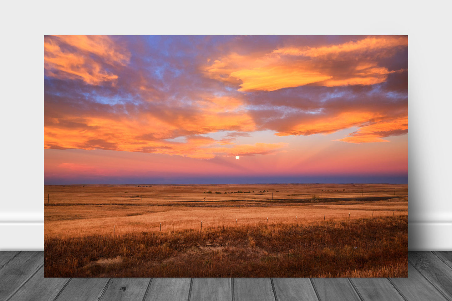 Great Plains metal print wall art of clouds illuminated by morning sunlight surrounding the moon over golden prairie on an autumn morning in Colorado by Sean Ramsey of Southern Plains Photography.