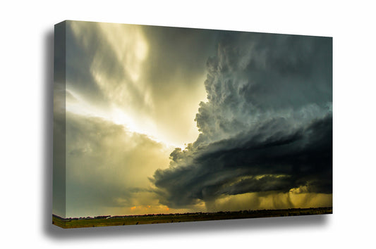 Storm canvas wall art of a supercell thunderstorm with sunbeams bursting out from behind on a stormy spring evening in Oklahoma by Sean Ramsey of Southern Plains Photography.