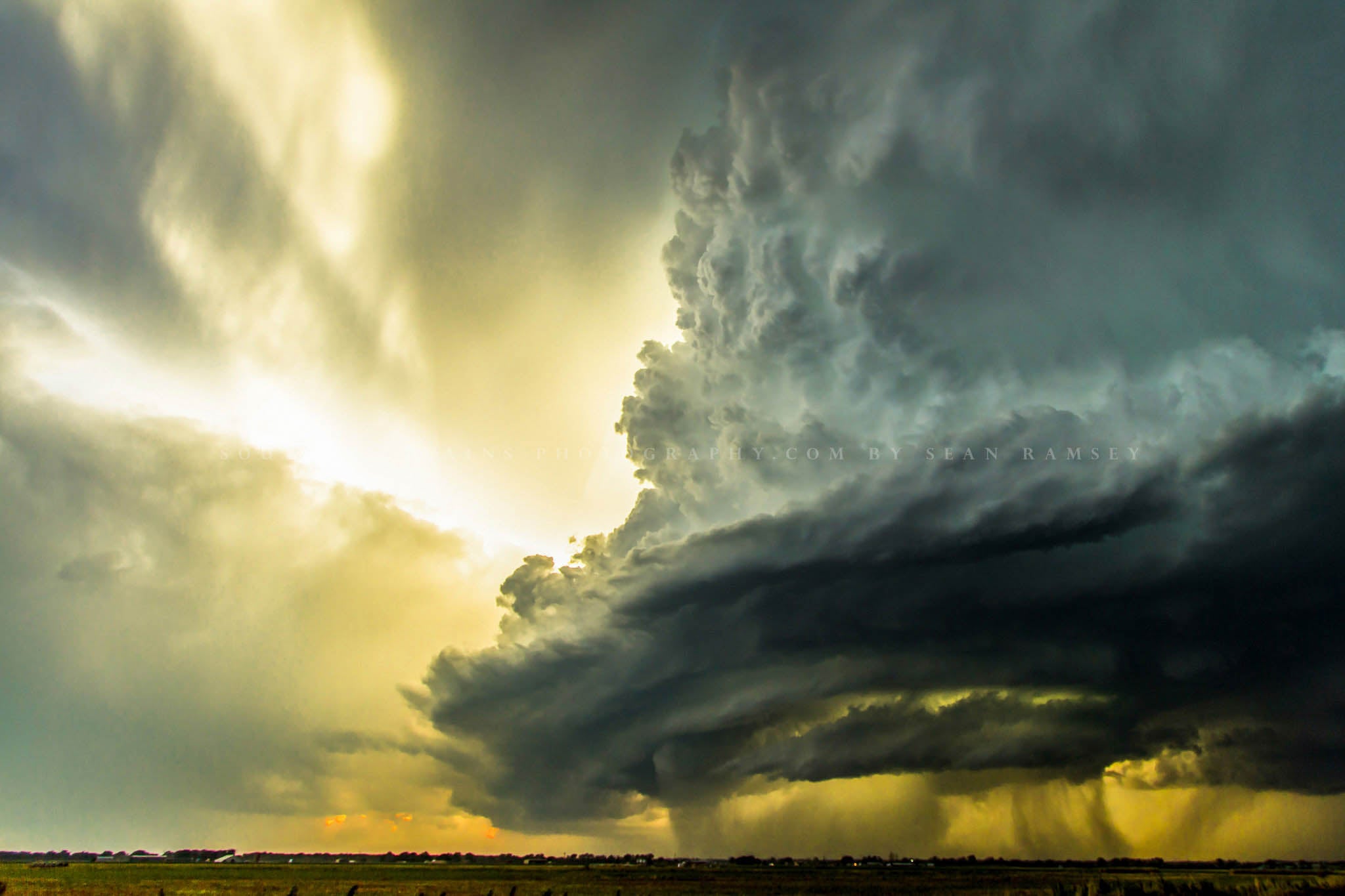 Storm photography print of an incredible supercell thunderstorm backlit by sunlight on a spring day in Oklahoma by Sean Ramsey of Southern Plains Photography.