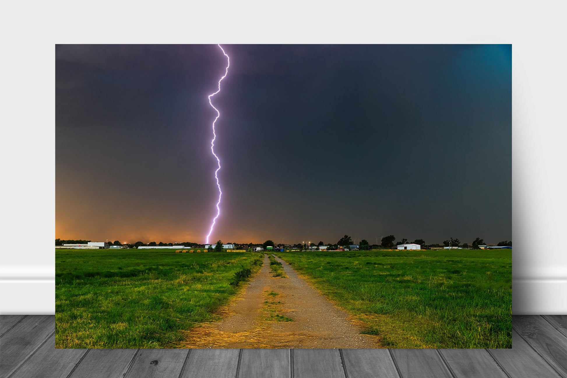 Storm aluminum metal print wall art of a lightning bolt striking from high above in the sky down a rural road on a stormy day in Oklahoma by Sean Ramsey of Southern Plains Photography.