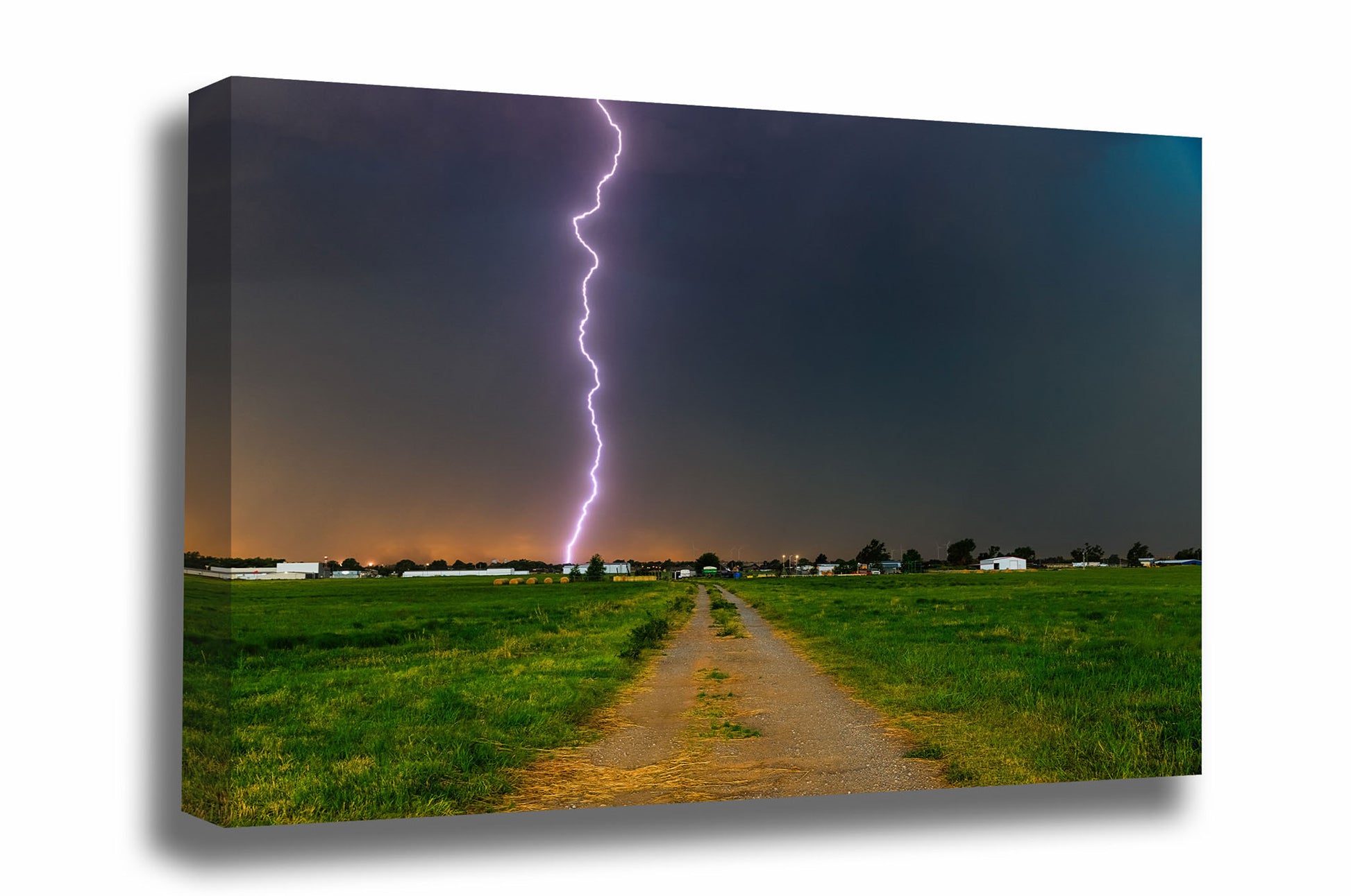 Storm canvas wall art of a lightning bolt striking from high above in the sky down a rural road on a stormy day in Oklahoma by Sean Ramsey of Southern Plains Photography.