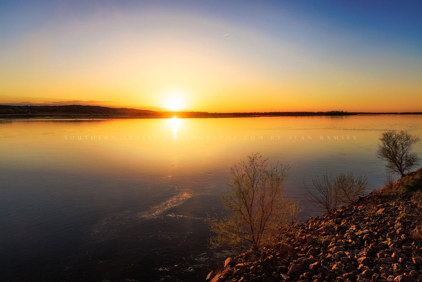 Midwest landscape photography print of a warm sunset taking place over the Missouri River on a spring evening along the South Dakota and Nebraska border by Sean Ramsey of Southern Plains Photography.