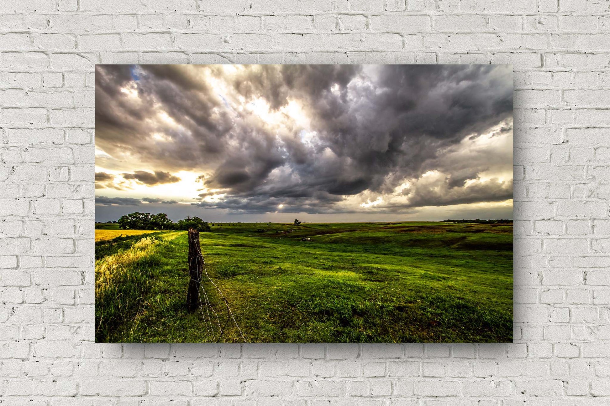 Great Plains metal print of golden sunlight filtering through storm clouds and shining down on the Nebraska prairie by Sean Ramsey of Southern Plains Photography.