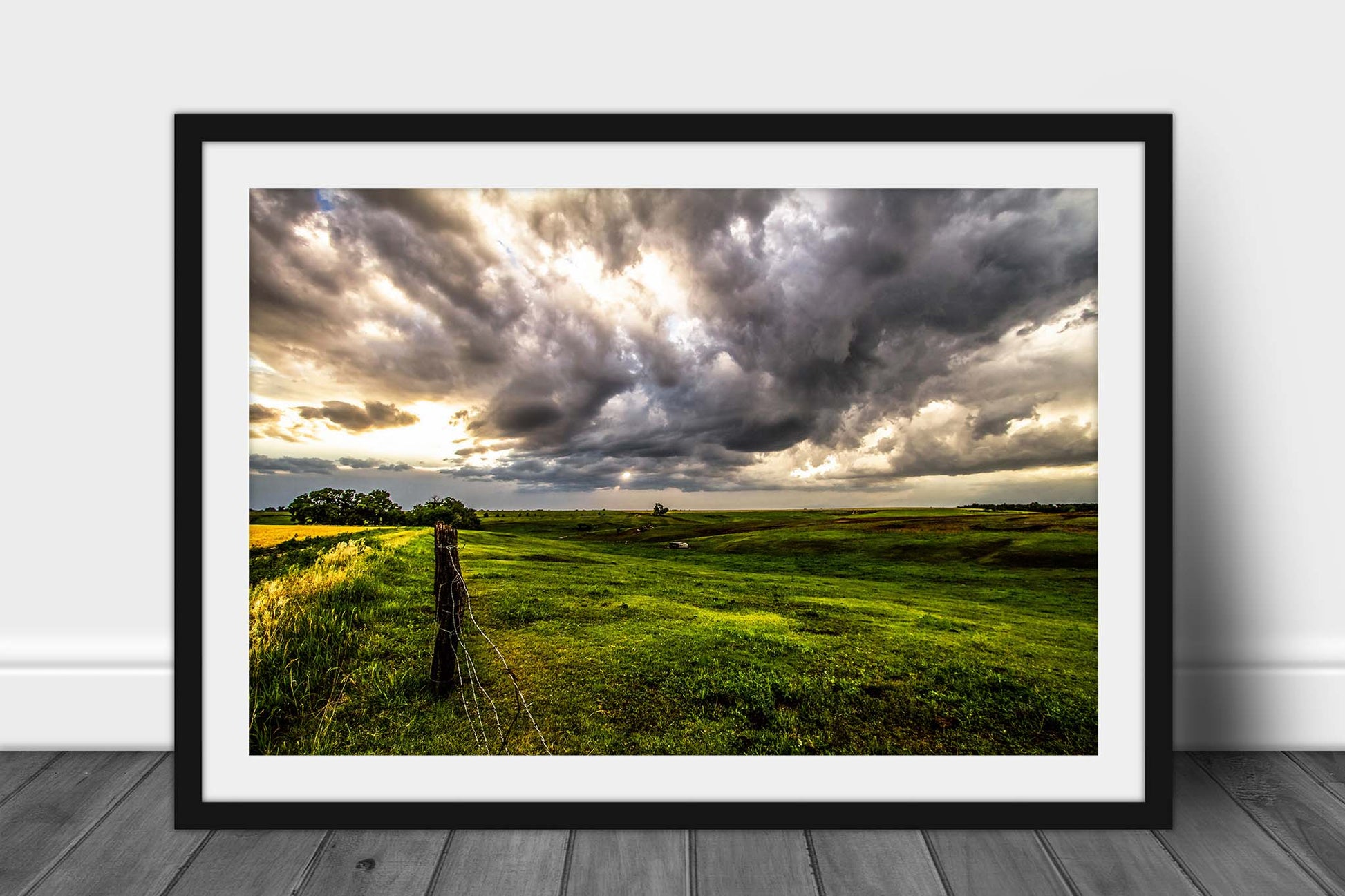 Great Plains framed print with optional mat of golden sunlight filtering through storm clouds onto the prairie on a spring day in Nebraska by Sean Ramsey of Southern Plains Photography.