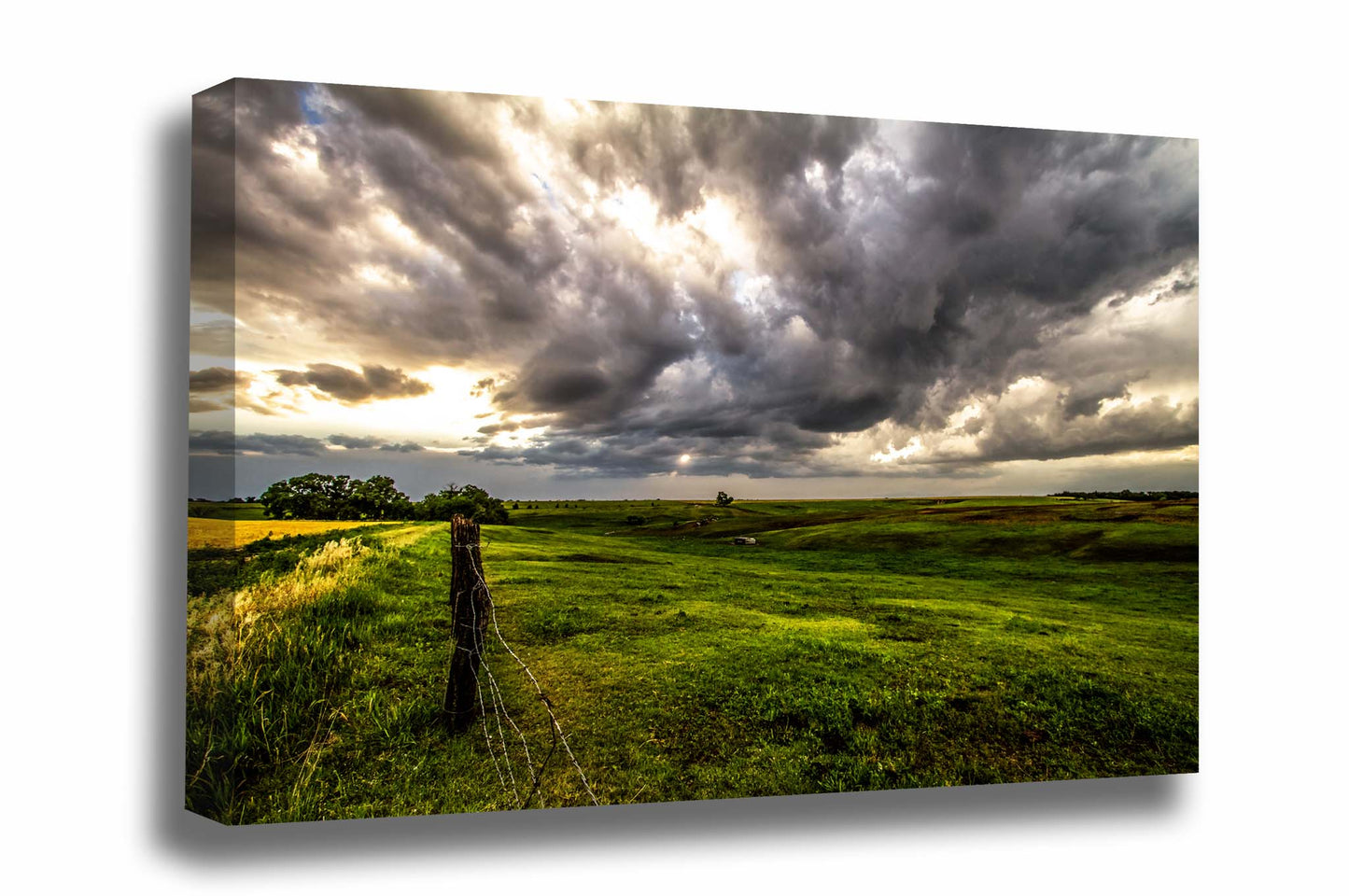 Great Plains canvas wall art of golden sunlight filtering through storm clouds and drenching the Nebraska prairie by Sean Ramsey of Southern Plains Photography.