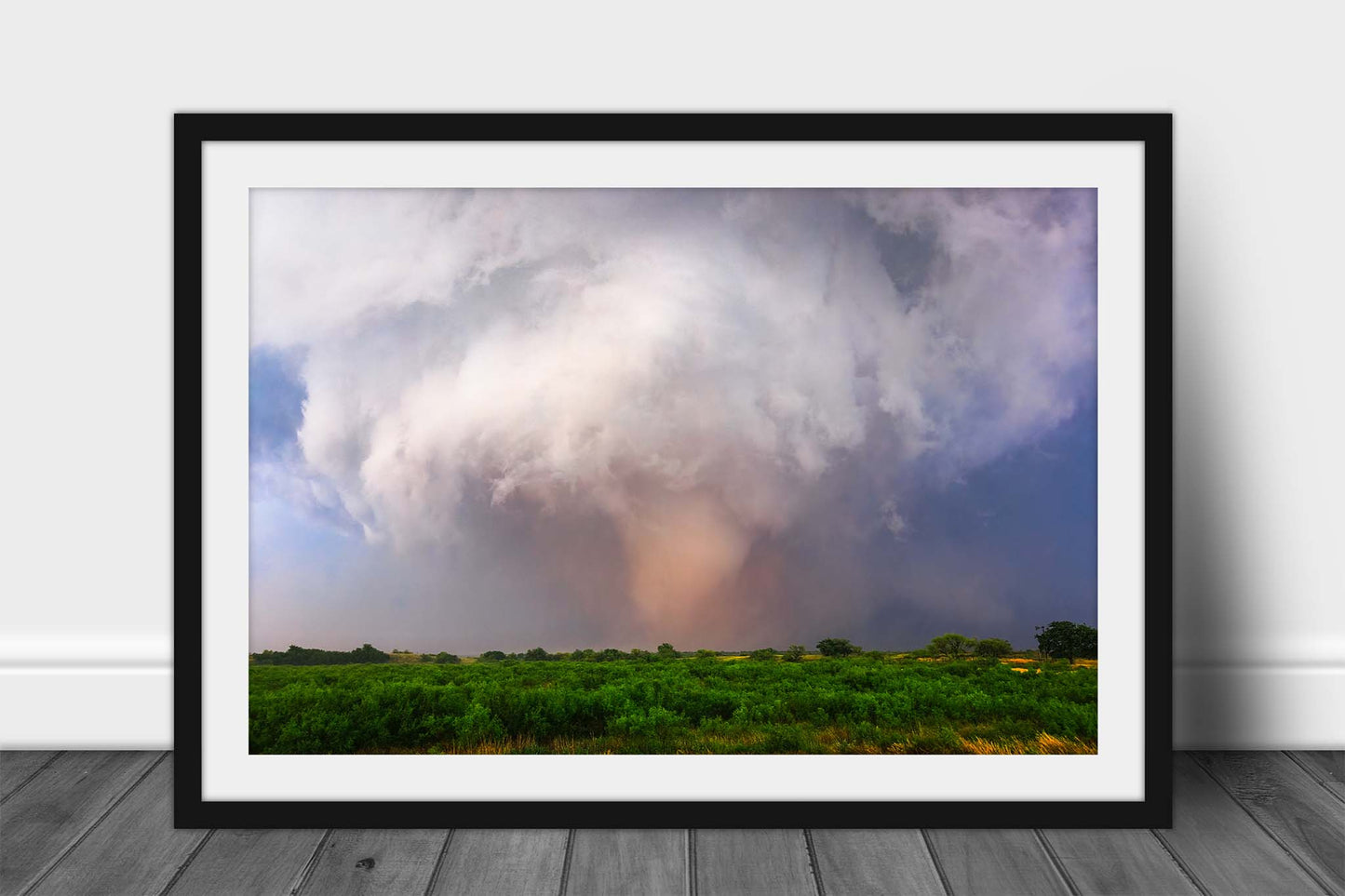 Framed storm print of a large tornado touching down near the Red River on a stormy day in Oklahoma by Sean Ramsey of Southern Plains Photography.