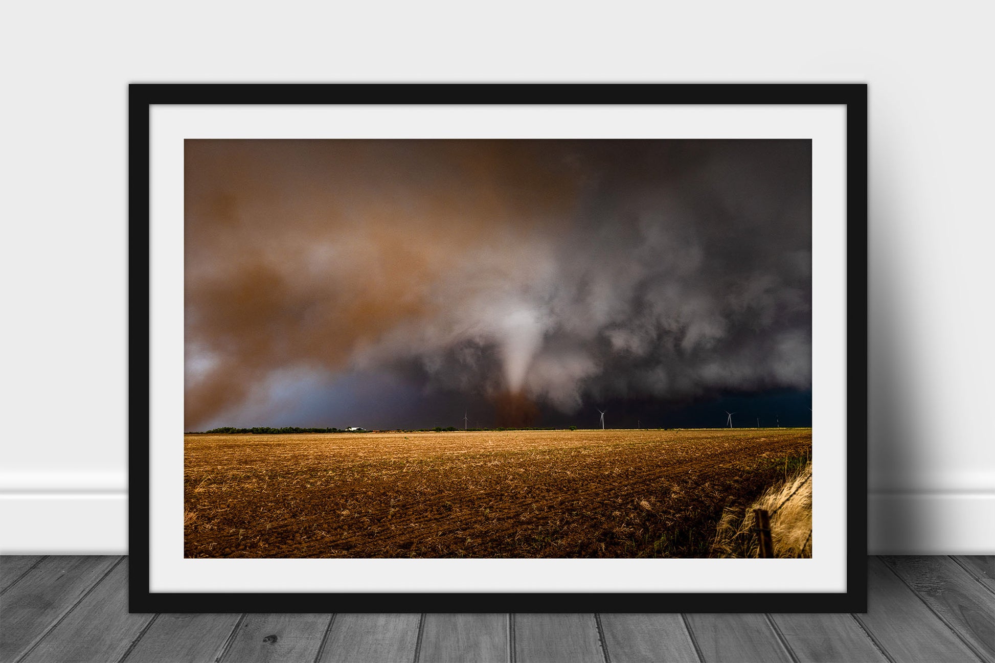 Framed and matted storm print of a tornado churning up dust over a field on a stormy spring day in Texas by Sean Ramsey of Southern Plains Photography.