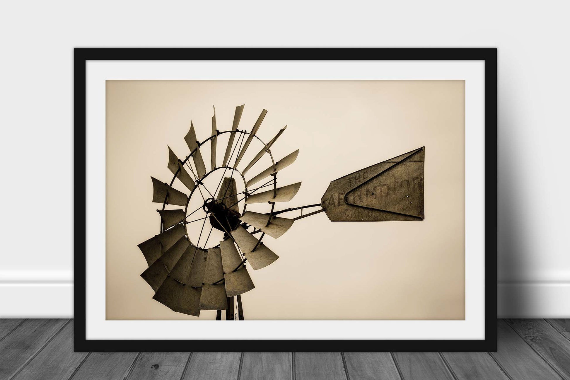 Framed and matted country print in sepia tone of a windmill head and tail on a farm in Iowa by Sean Ramsey of Southern Plains Photography.