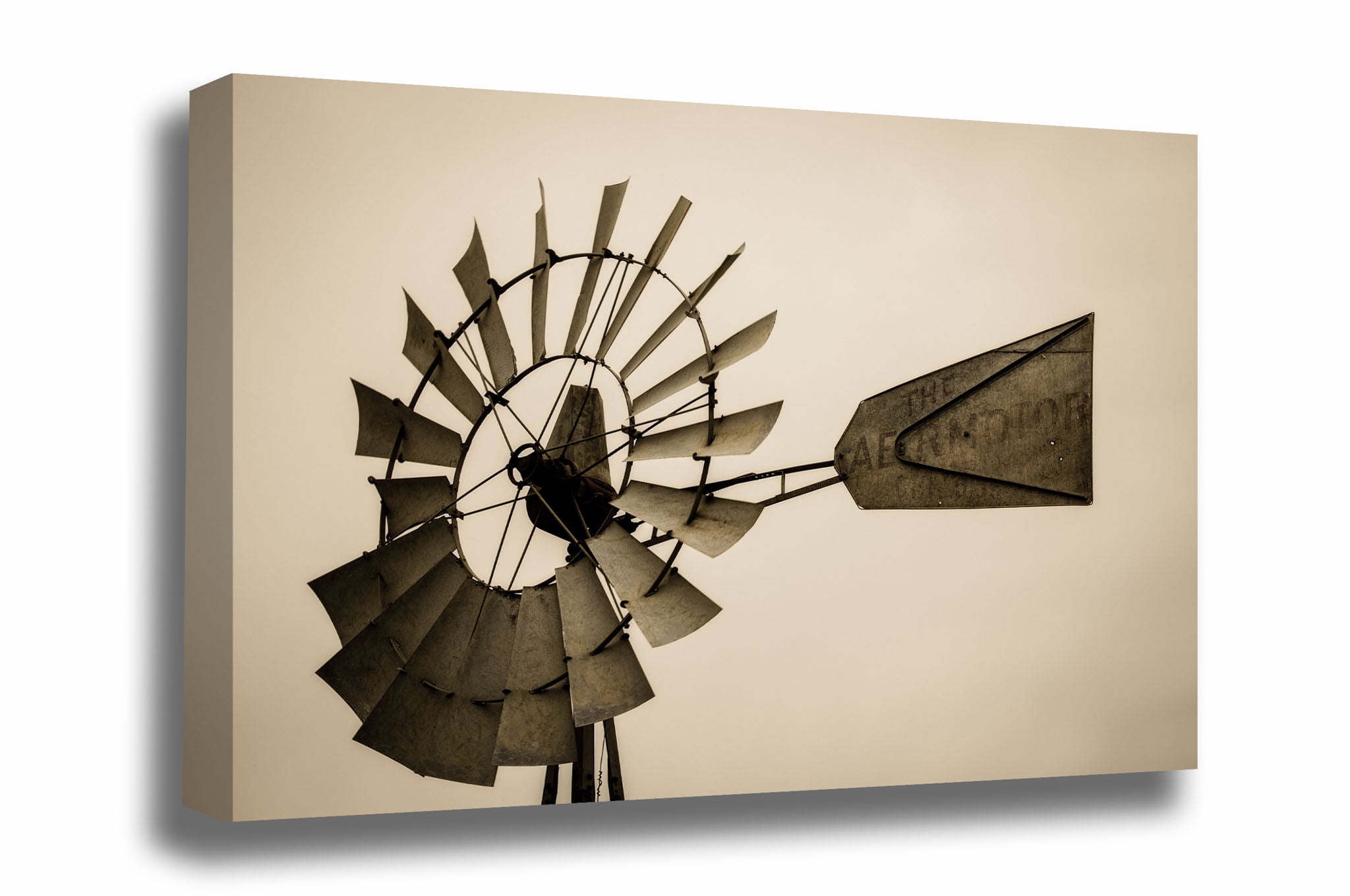 Country canvas wall art of a windmill head and tail against a rainy sky on a farm in Iowa in sepia tone by Sean Ramsey of Southern Plains Photography.