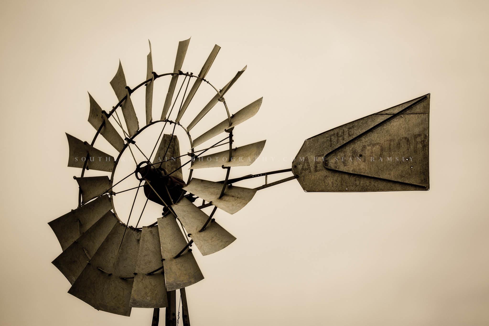 Country photography print in sepia tone of an old windmill head and tail on a farm in Iowa by Sean Ramsey of Southern Plains Photography.