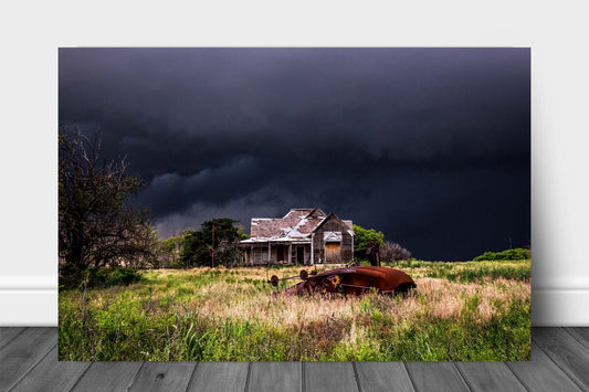 Moody country metal print on aluminum of a classic cotton gin in the front yard of an old abandoned house on a stormy spring evening in Texas by Sean Ramsey of Southern Plains Photography.
