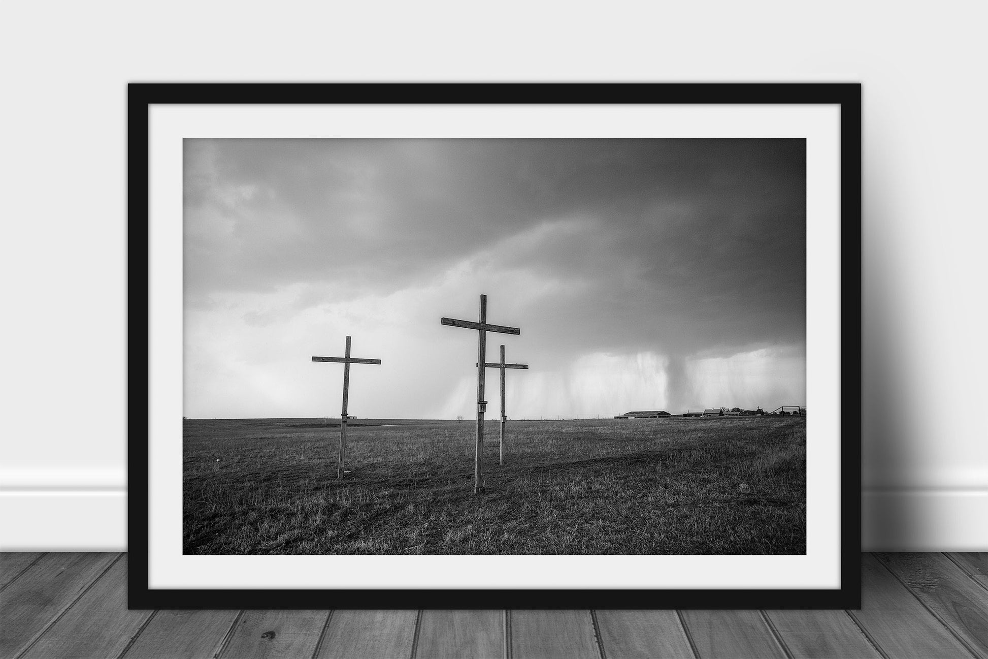 Framed and matted spiritual print in black and white of three wooden crosses on a stormy day in Texas by Sean Ramsey of Southern Plains Photography.