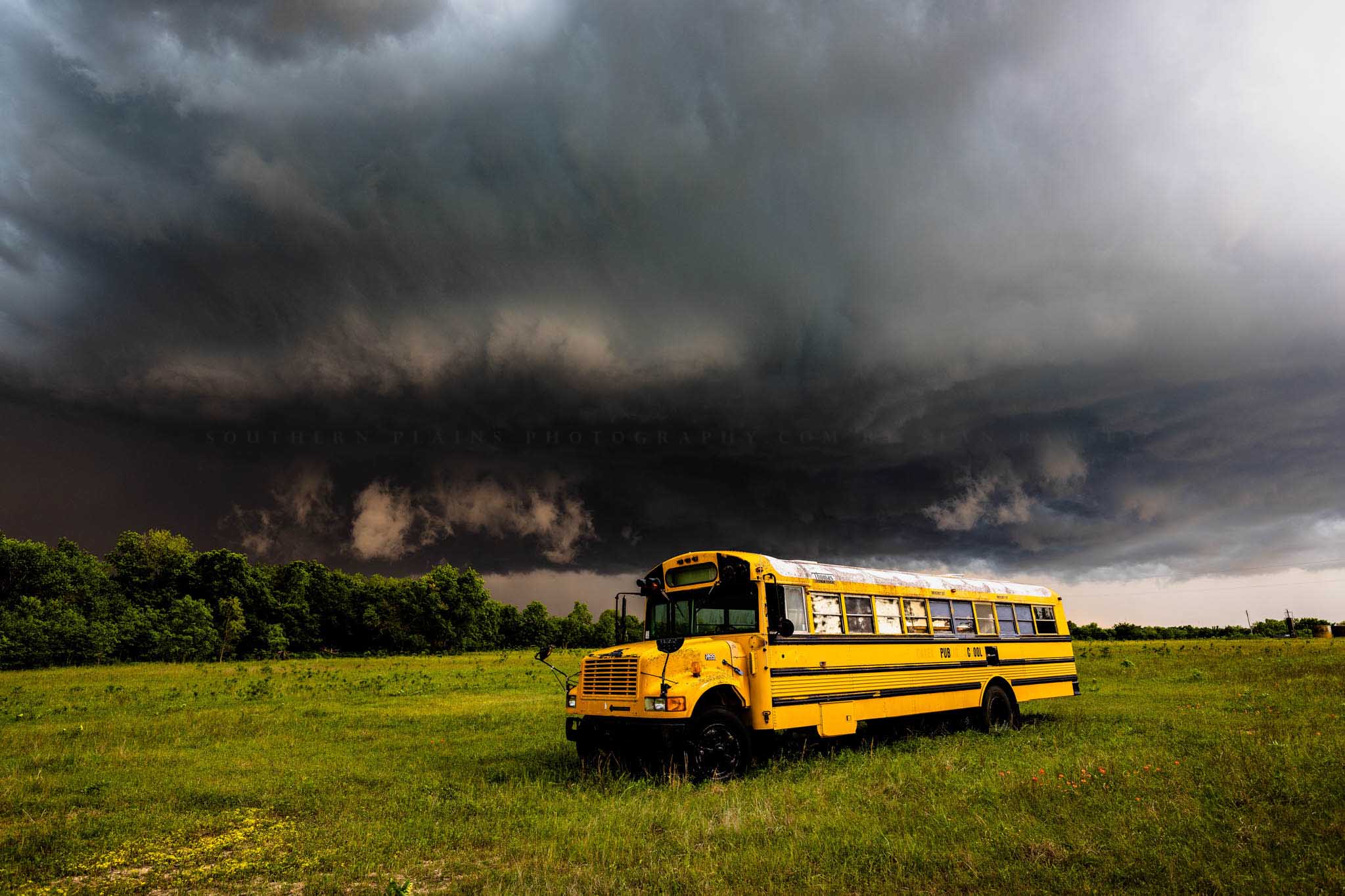 Storm photography print of a thunderstorm advancing over an old school bus on a stormy spring day in Oklahoma by Sean Ramsey of Southern Plains Photography.