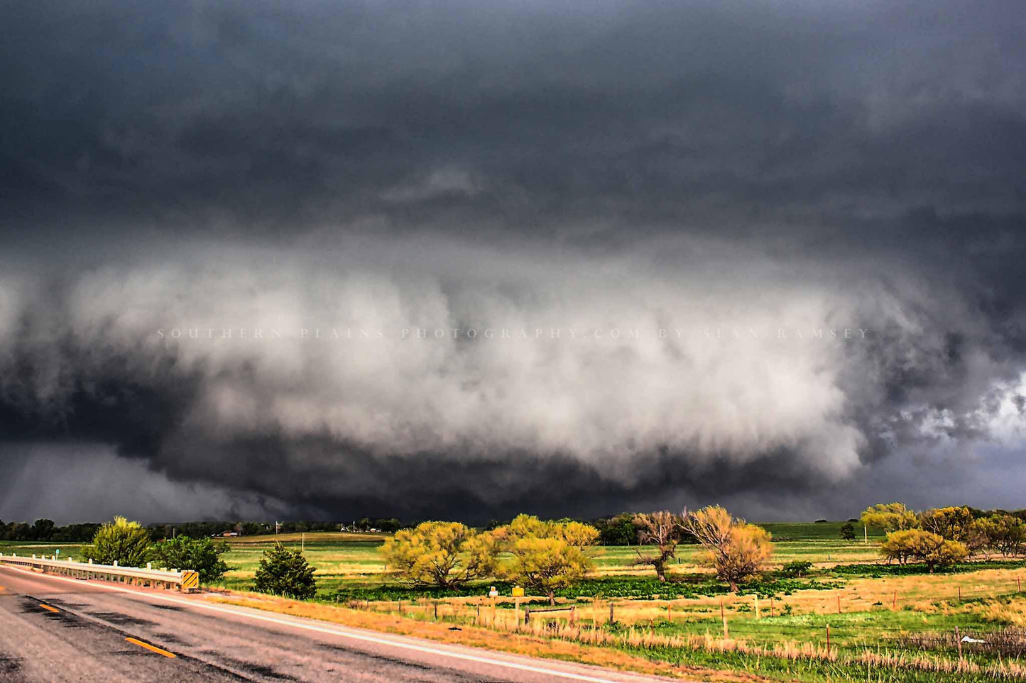 Storm photography print of a wide tornado touching down over a field on a stormy spring day in Oklahoma by Sean Ramsey of Southern Plains Photography.