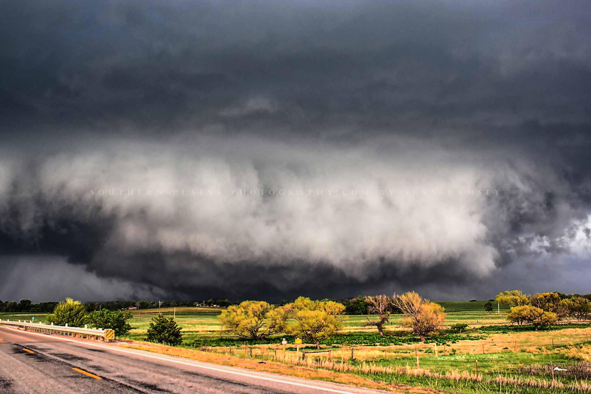 Storm photography print of a wide tornado touching down over a field on a stormy spring day in Oklahoma by Sean Ramsey of Southern Plains Photography.