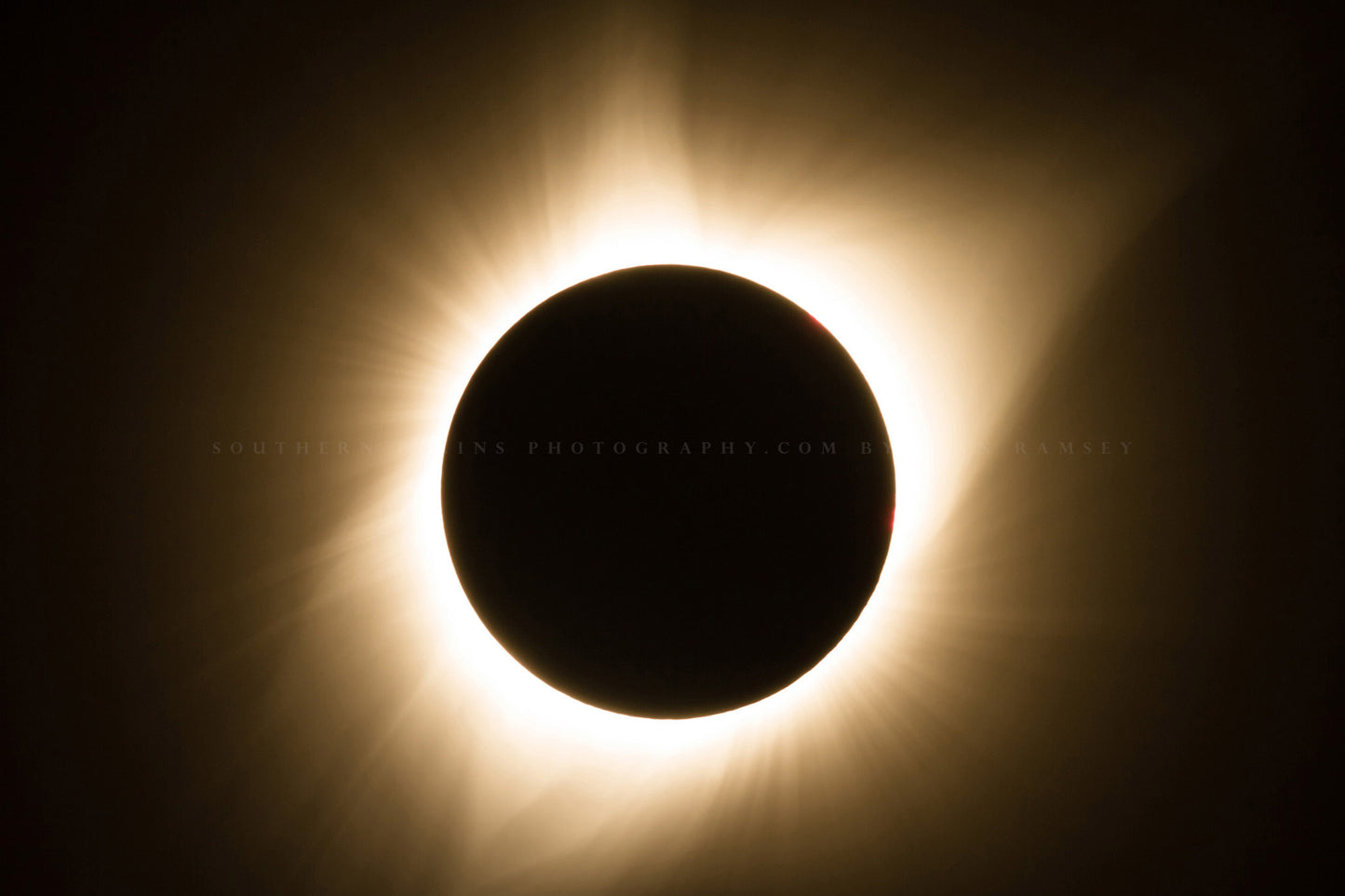 Celestial photography print of a total solar eclipse with bright gold corona taking place on a summer day in Nebraska by Sean Ramsey of Southern Plains Photography.